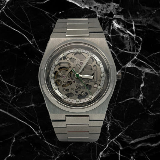 Luxury silver watch with mechanical components on a dark marble background