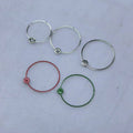 A set of circular watch hands, made from polished silver, shown in red, green and silver colour options