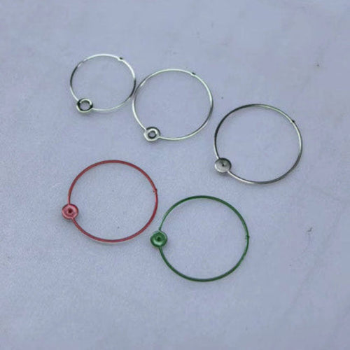 A set of circular watch hands, made from polished silver, shown in red, green and silver colour options