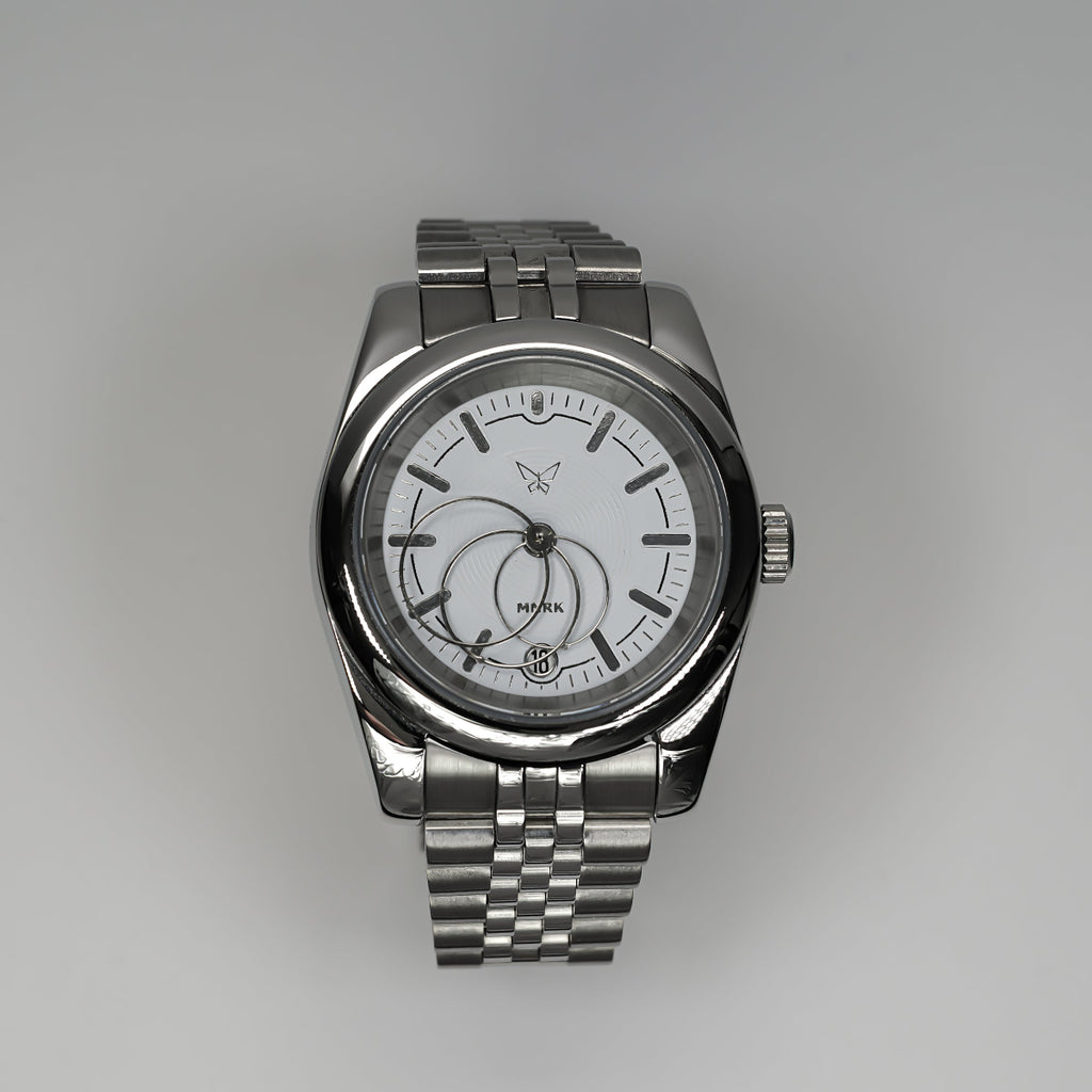 Luxury silver watch, with a white dial and circular hands, viewed from the front.